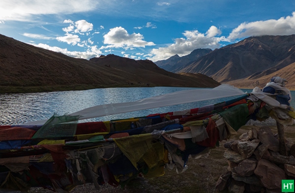 Prayer flags by Chandratal—classic final night on the Manali–Kunzum–Spiti road trip when the pass is open.