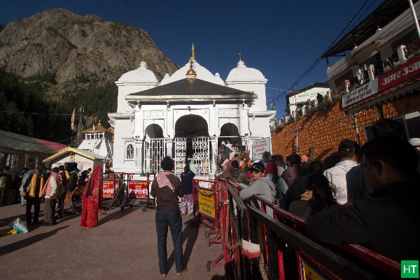 Pilgrims standing in queue at Gangotri Temple, a Hindu shrine dedicated to Goddess Ganga in Uttarakhand.